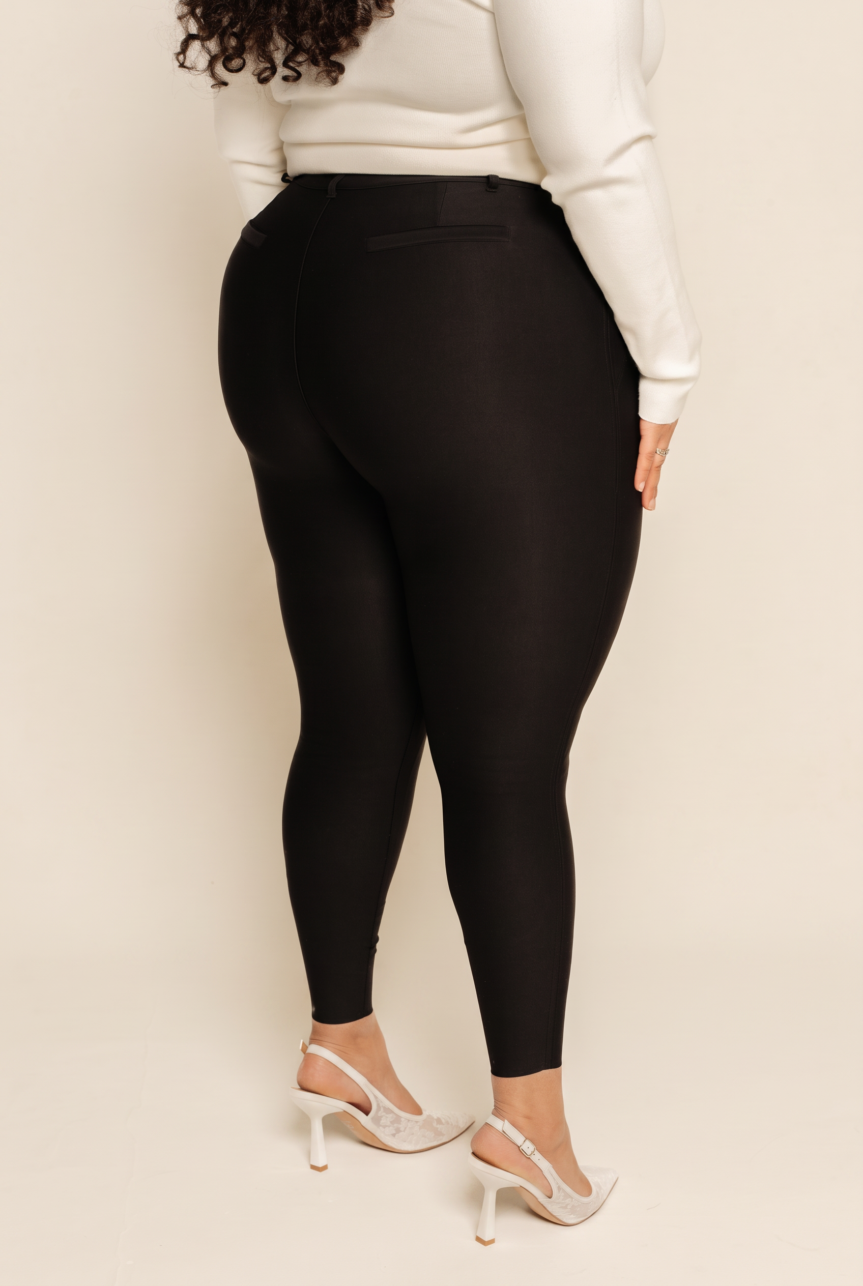 Back view of black compression leggings